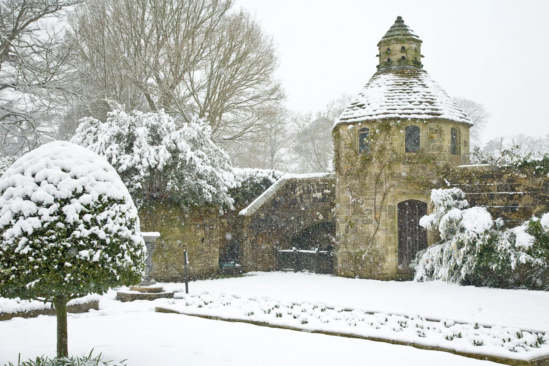 Dovecote and Topiary in Snow, Handcross, West Sussex