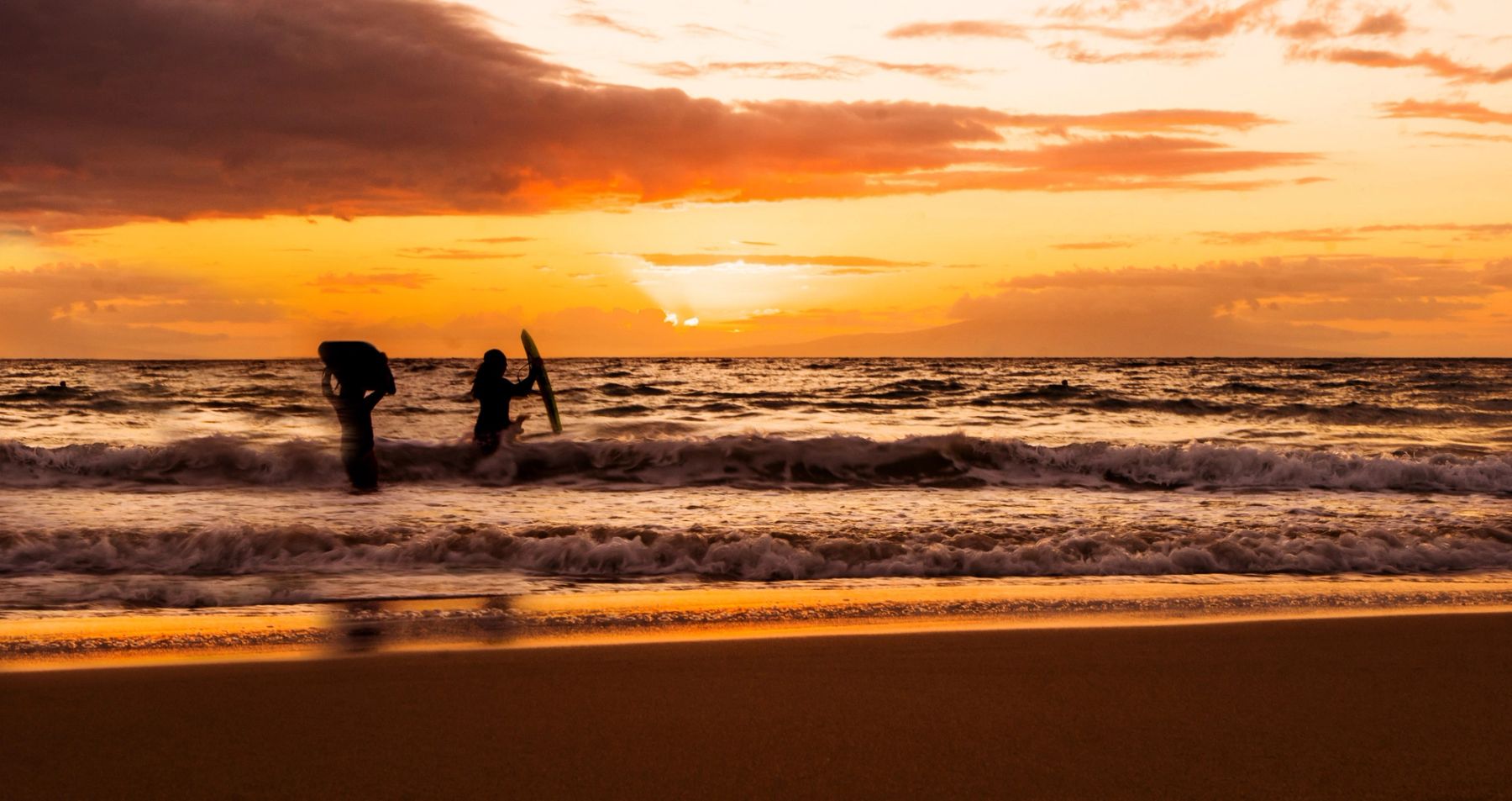 Surfers at Sundown, Maui, Hawaii
